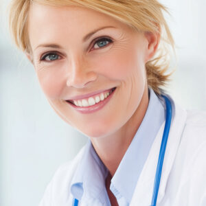 Short, blonde-haired, female doctor smiling, needing credentialing