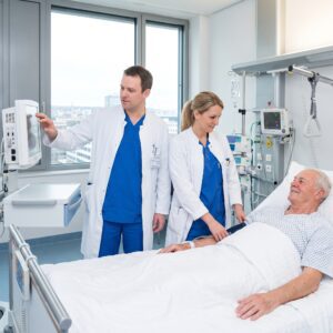 Doctors Treating Elderly Male Patient