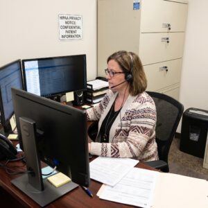 Hipaa Compliant Medical Biller at Work, in Cubicle