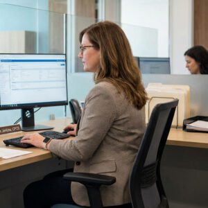 Credentialing Specialist Entering Provider Information into an Online Payer Enrollment Portal